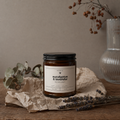 TenTen Eucalyptus and Lavender 255g candle on raw timber with dried botanicals